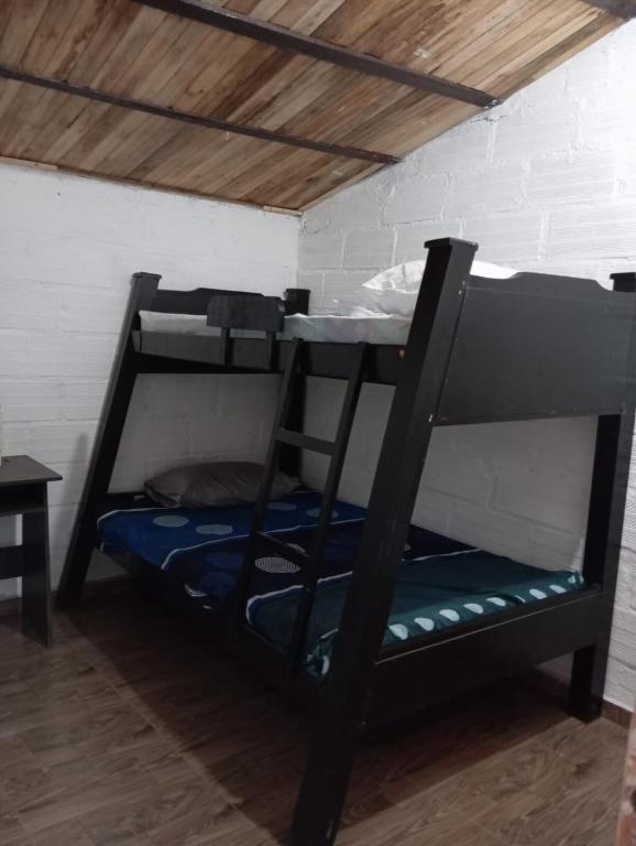 Postel nebo postele na pokoji v ubytování Hostal otro cuento
