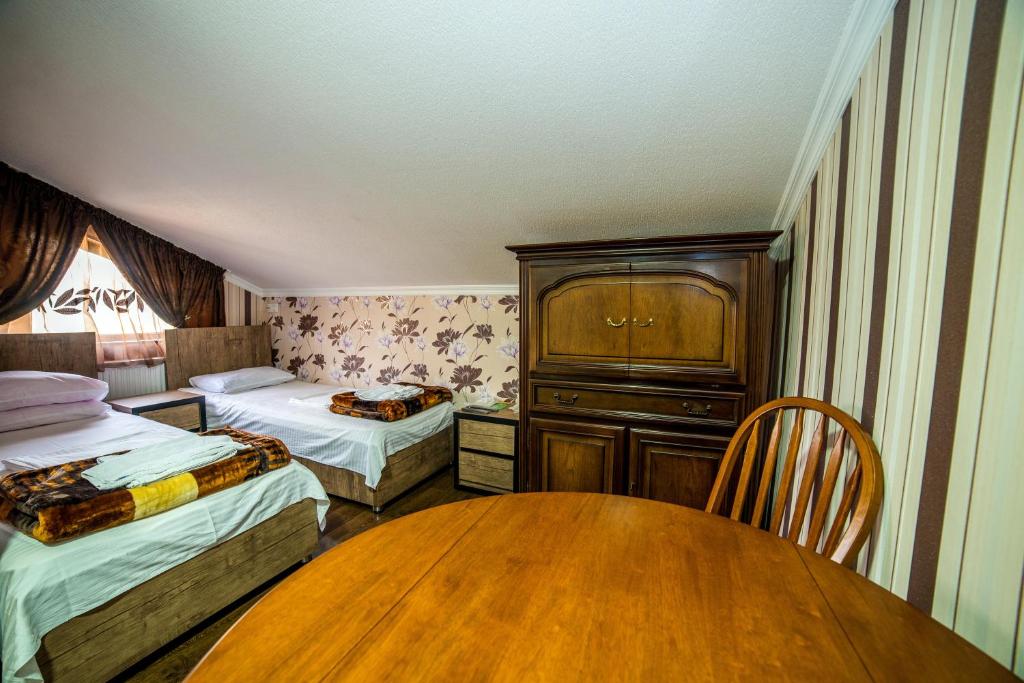 Postel nebo postele na pokoji v ubytování HOTEL GUGLUX &WINE CELLAR
