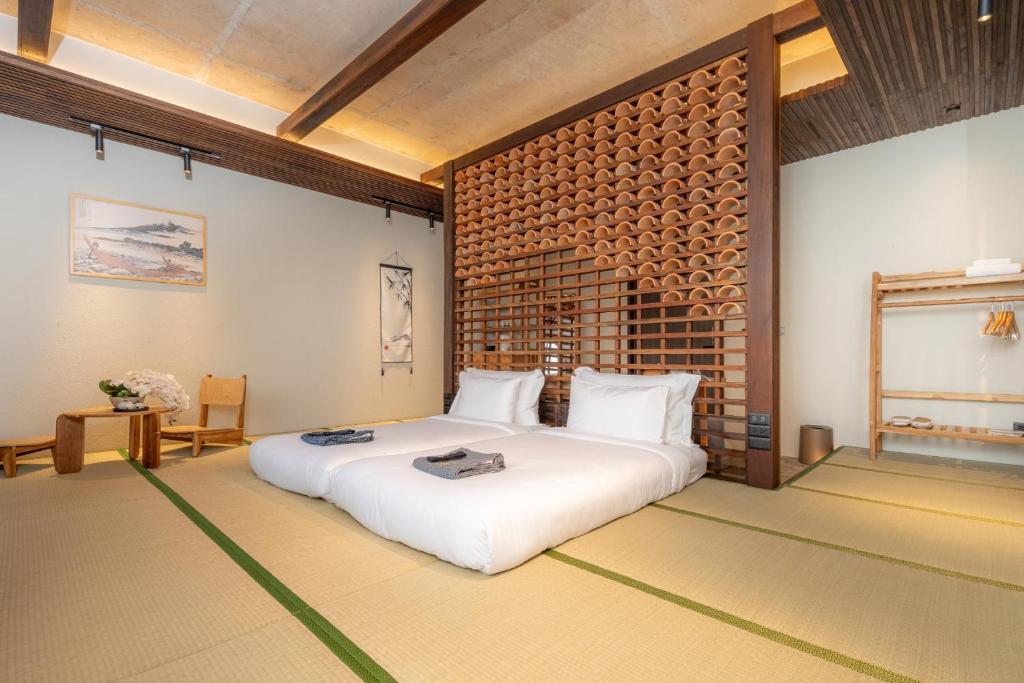 Postel nebo postele na pokoji v ubytování Hoshi Hotel Hatyai
