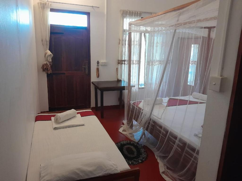 Postel nebo postele na pokoji v ubytování A 50 Arugambay