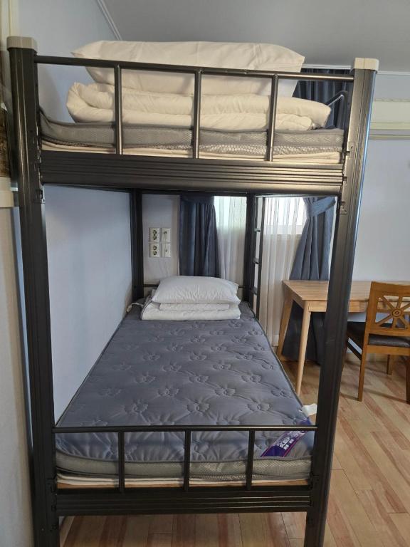 Postel nebo postele na pokoji v ubytování Appletree Hotel Pohang