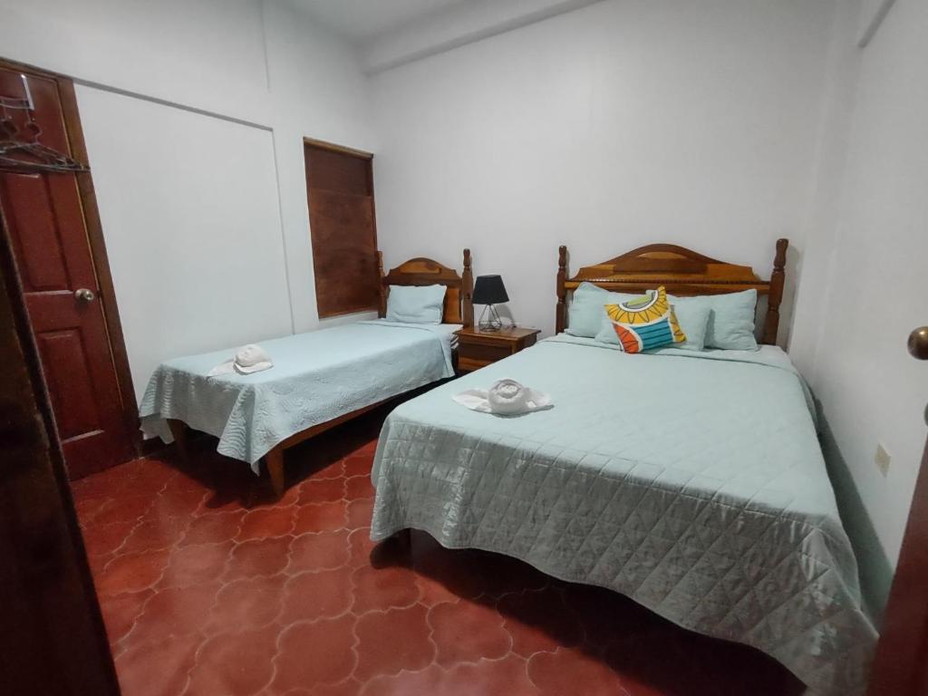 Postel nebo postele na pokoji v ubytování Hotel Casa de Copan