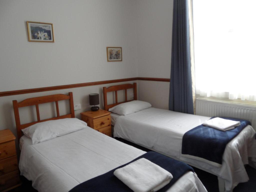 Letto o letti in una camera di Hotel Meridiana