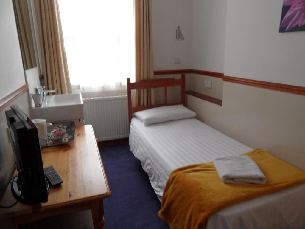 Letto o letti in una camera di Hotel Meridiana