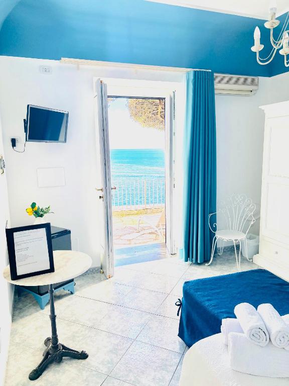Postel nebo postele na pokoji v ubytování La Maliosa Positano