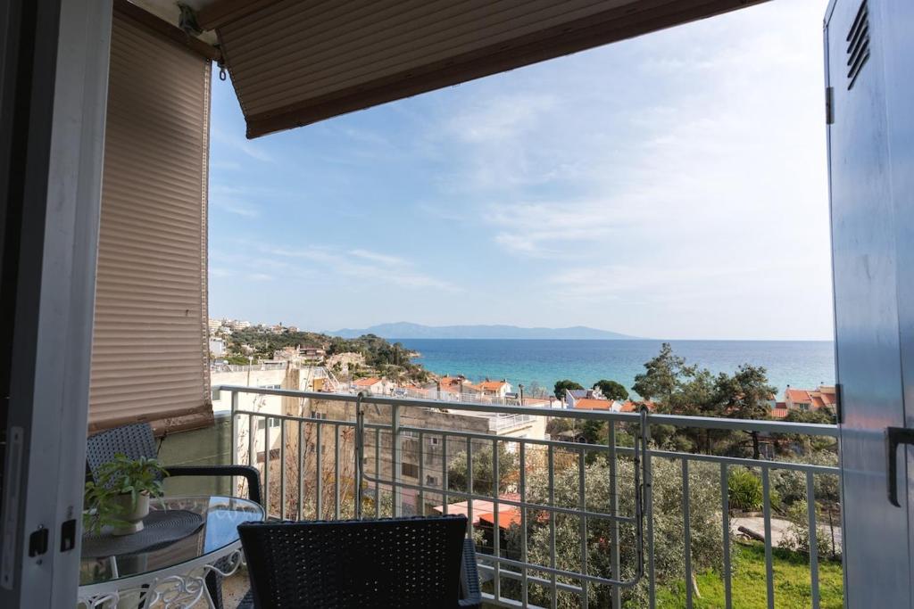 a balcony with a view of the ocean at Sea Zen in Paleo Tsifliki