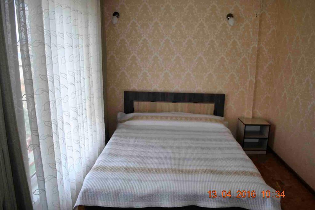 Postel nebo postele na pokoji v ubytování Dome Hotel