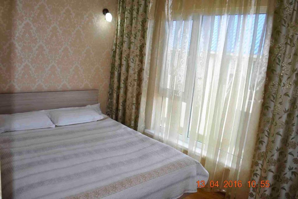 Postel nebo postele na pokoji v ubytování Dome Hotel