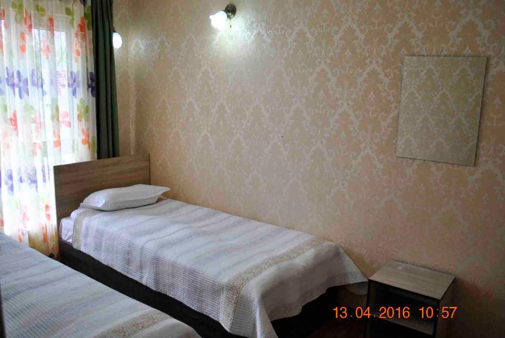Postel nebo postele na pokoji v ubytování Dome Hotel