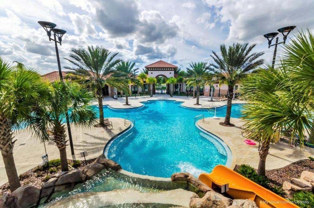 a pool at a resort with palm trees at 5259-6-WW-Pool&SPA Lazy River&Slides in Davenport