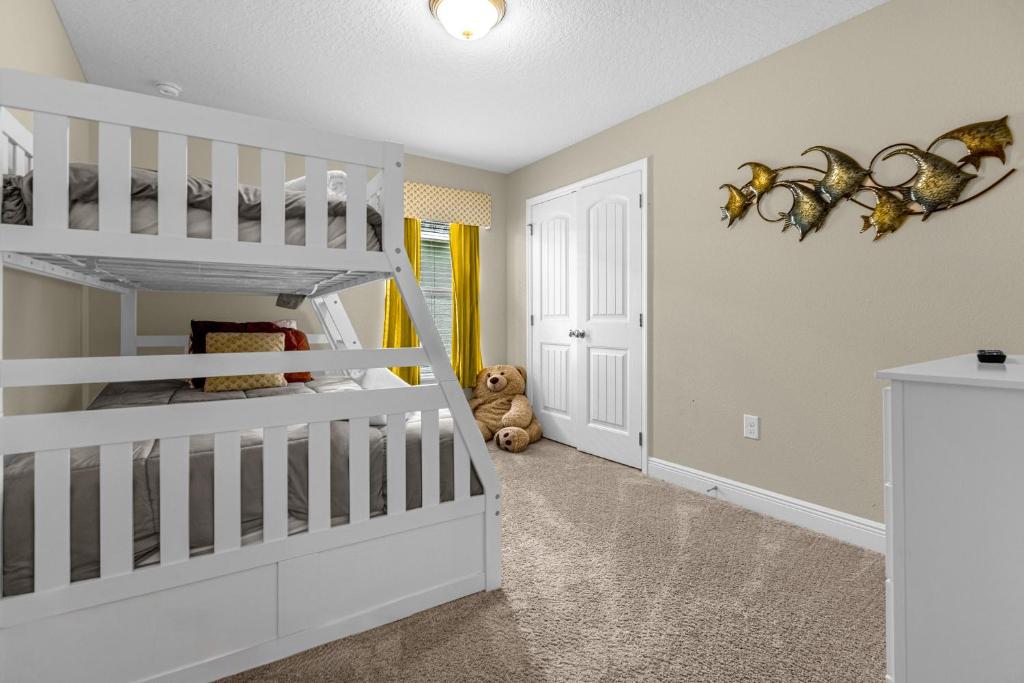 a white room with a bunk bed and a staircase at 5259-6-WW-Pool&SPA Lazy River&Slides in Davenport