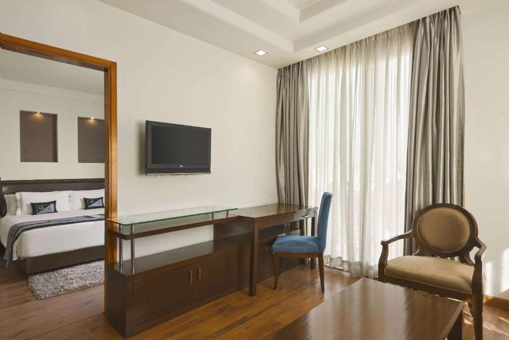 TV a/nebo společenská místnost v ubytování Ramada By Wyndham Jaipur