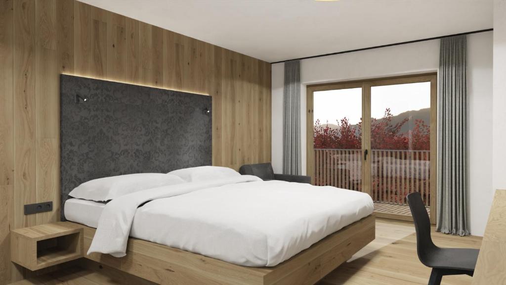 Postel nebo postele na pokoji v ubytování Berghotel Alpenklang