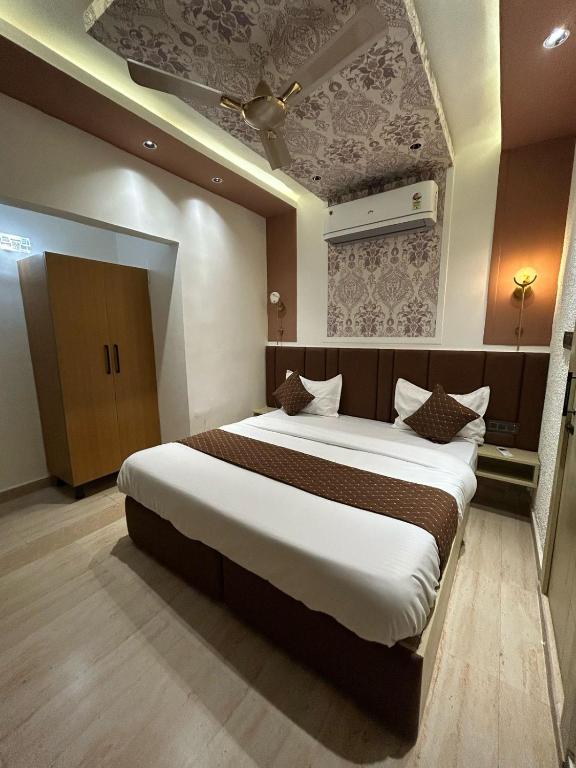 Postel nebo postele na pokoji v ubytování Divine Hotel