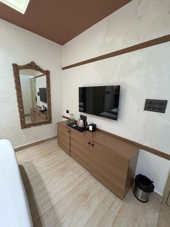 TV a/nebo společenská místnost v ubytování Divine Hotel