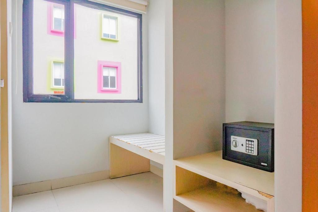 TV a/nebo společenská místnost v ubytování Collection O Hotel Antara