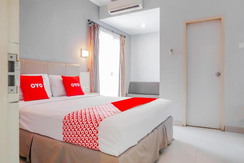 Postel nebo postele na pokoji v ubytování Collection O Hotel Antara
