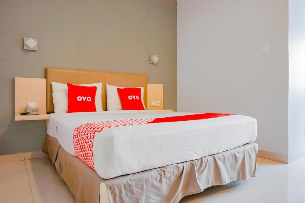 Postel nebo postele na pokoji v ubytování Collection O Hotel Antara