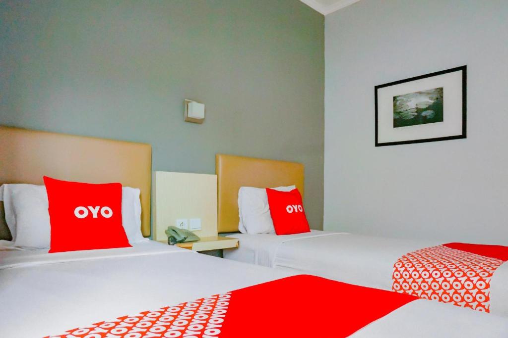 Postel nebo postele na pokoji v ubytování Collection O Hotel Antara