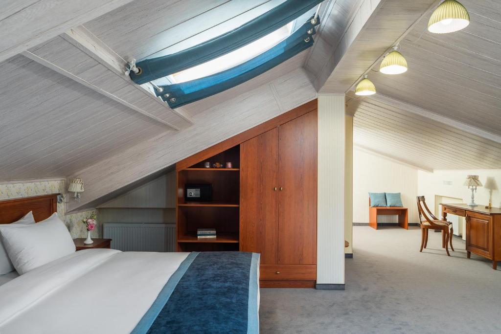 Postel nebo postele na pokoji v ubytování Mozart Hotel