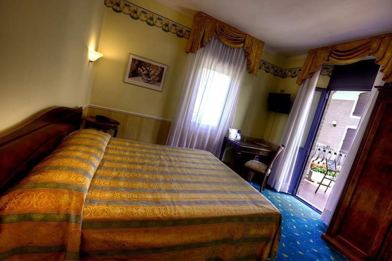 Postel nebo postele na pokoji v ubytování Hotel Castello