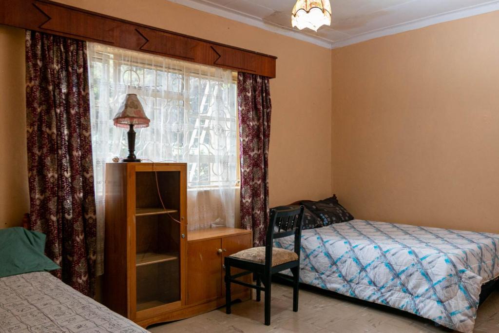 En eller flere senger på et rom på The Hideaways Eldoret