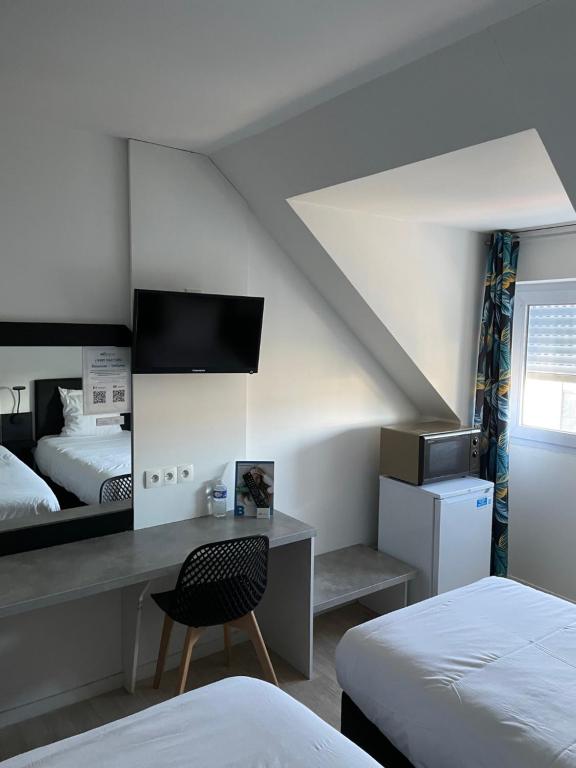 Postel nebo postele na pokoji v ubytování Brit Hotel Cherbourg