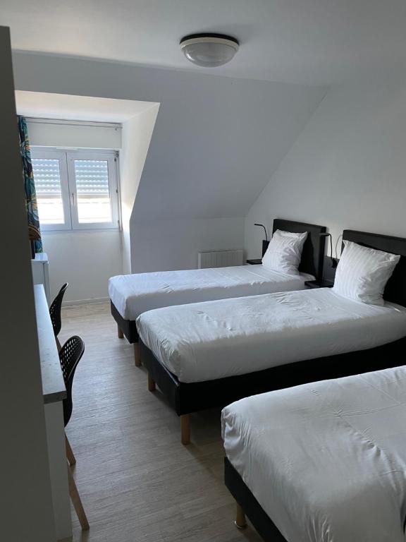 Postel nebo postele na pokoji v ubytování Brit Hotel Cherbourg