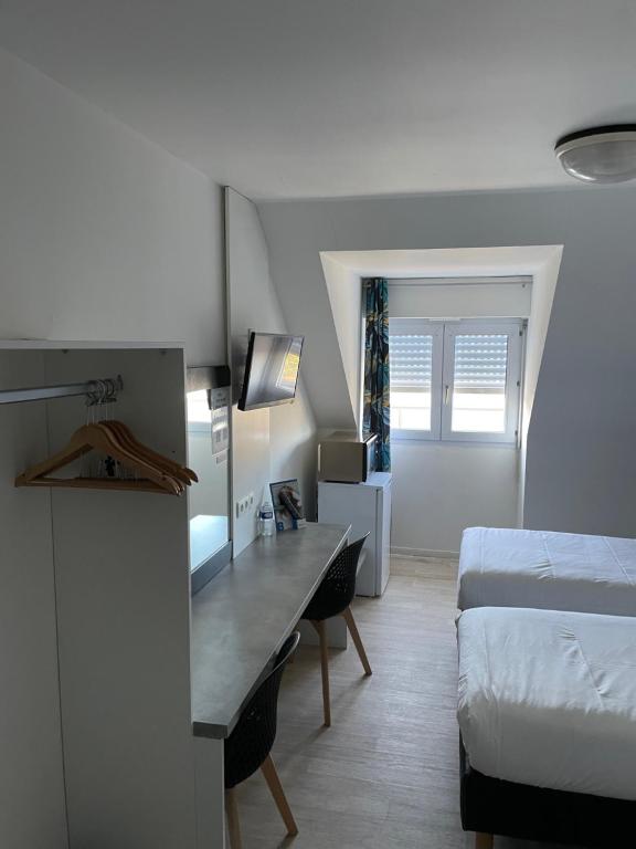 Postel nebo postele na pokoji v ubytování Brit Hotel Cherbourg