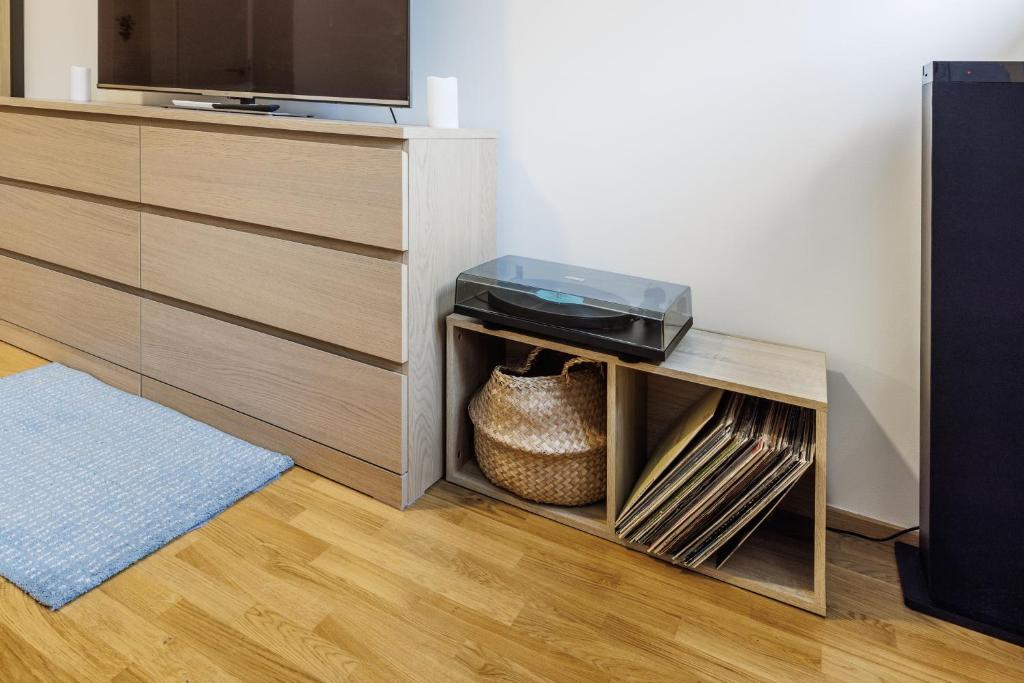 a room with a dresser with a television on it at Jasmínový Ráj in Vítkovice