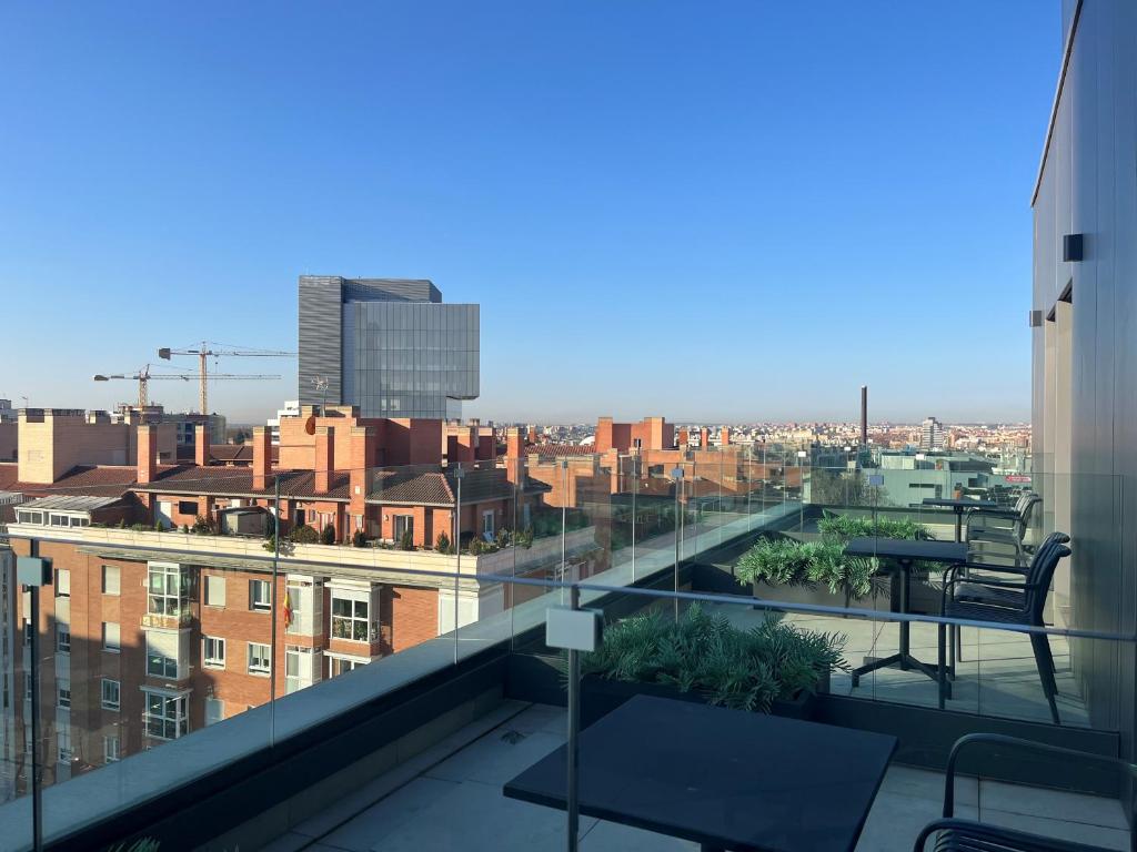 a view of a city from a building balcony at Hs Madrid Centro Atocha in Madrid