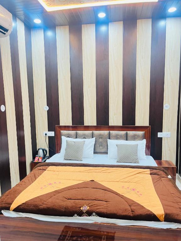 Voodi või voodid majutusasutuse Archana Guest House toas