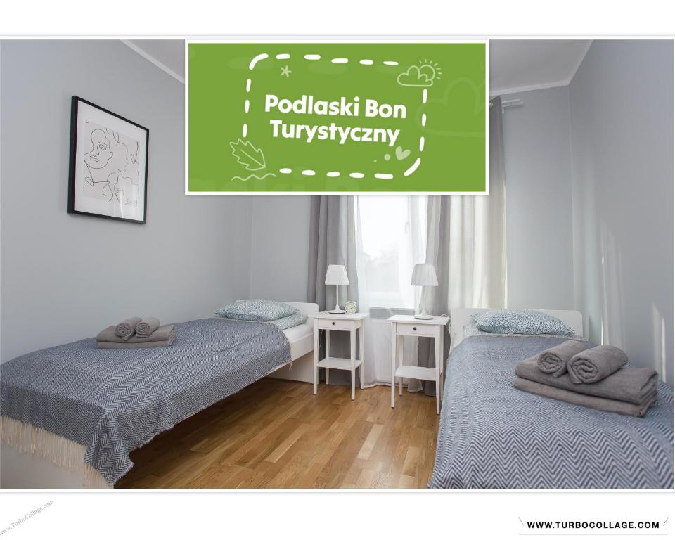 Posteľ alebo postele v izbe v ubytovaní CR Apartament Centrum Zamenhofa 1