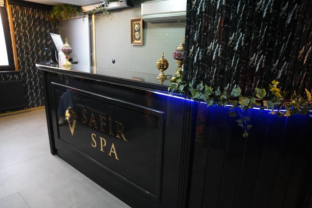 a black bar with a sign that reads star spa at Safir Hotels Silivri in Silivri
