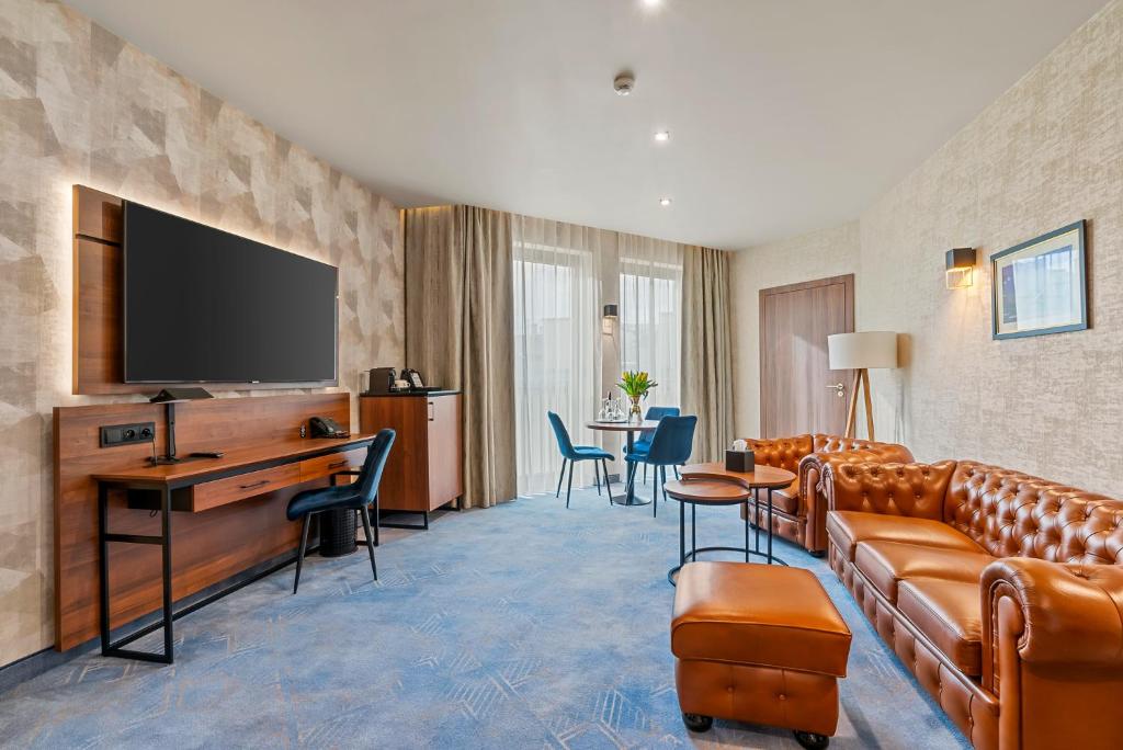 Televízia a/alebo spoločenská miestnosť v ubytovaní Hotel Diament Plaza Katowice