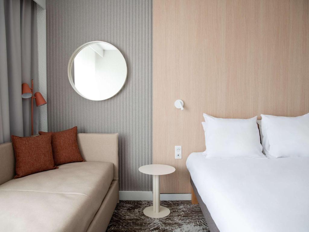 Postel nebo postele na pokoji v ubytování Novotel Antwerpen - Ekeren