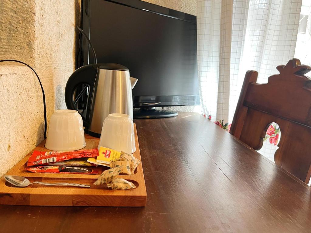 TV a/nebo společenská místnost v ubytování Gedik Cave Hotel