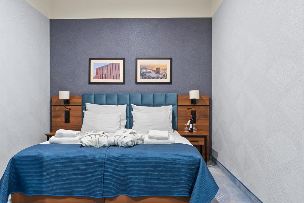 Posteľ alebo postele v izbe v ubytovaní Hotel Diament Plaza Katowice