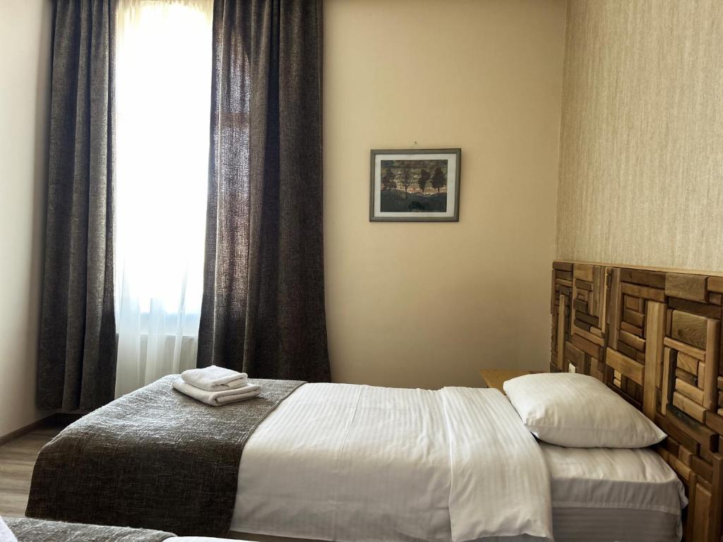 Postel nebo postele na pokoji v ubytování 21 Rooms Hotel