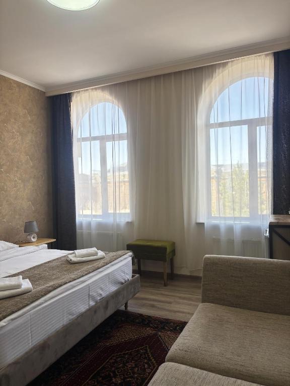 Postel nebo postele na pokoji v ubytování 21 Rooms Hotel