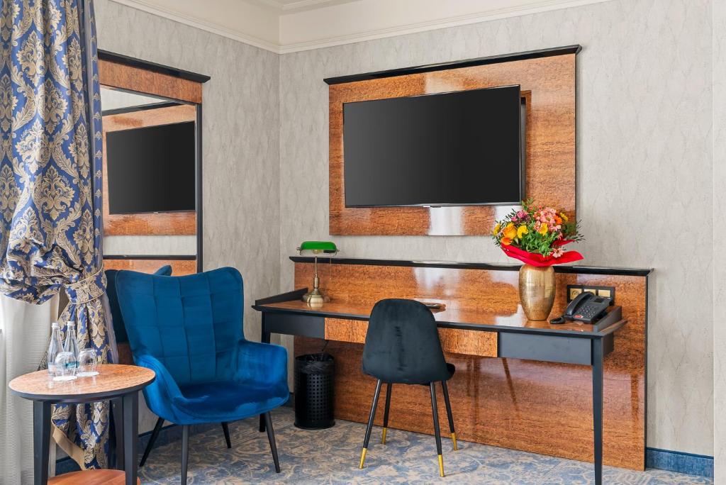 Televízia a/alebo spoločenská miestnosť v ubytovaní Hotel Diament Plaza Katowice