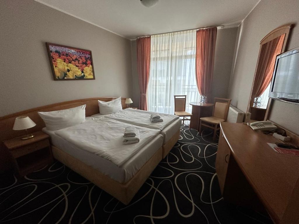 Postel nebo postele na pokoji v ubytování Trofana Wellness & SPA