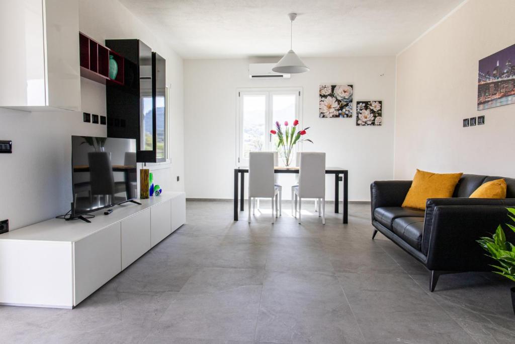 a living room with a couch and a table at VivimiHome - Monti House in Monti