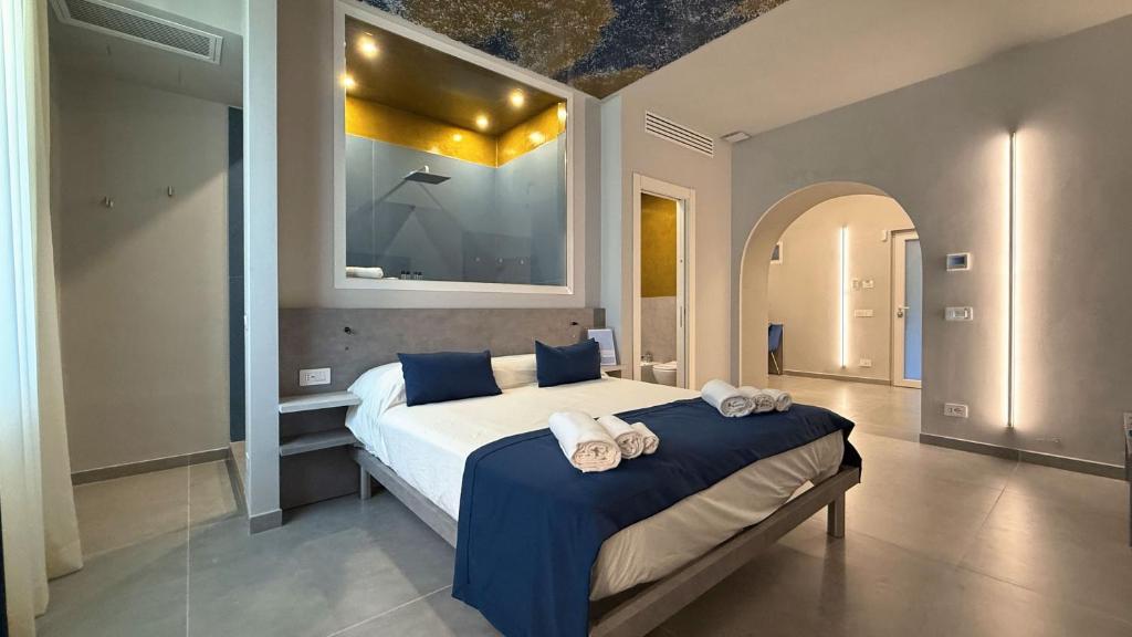 Postel nebo postele na pokoji v ubytování Shanti Rooms & Apartments Lucullo