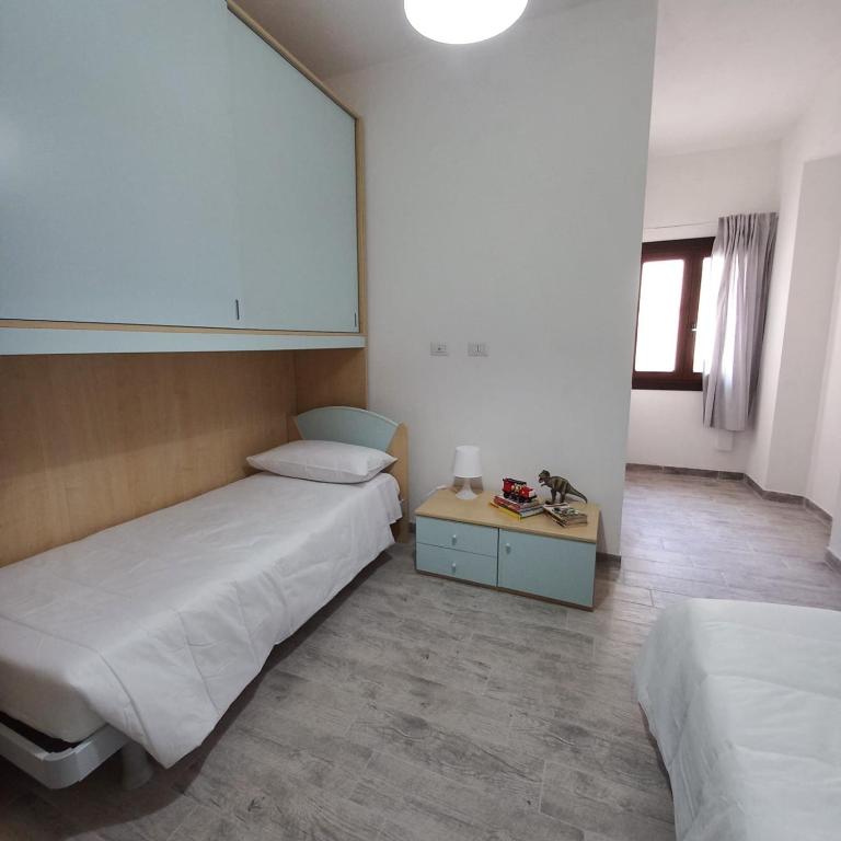 Postel nebo postele na pokoji v ubytování WindwoW - Your flat in Baunei