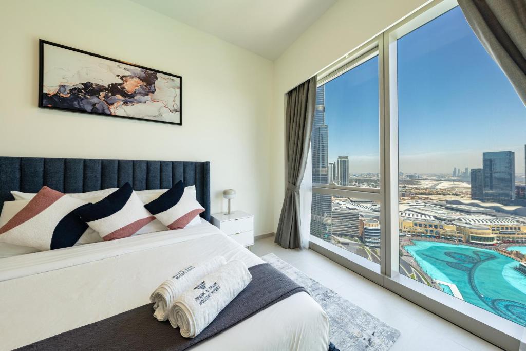 Ένα ή περισσότερα κρεβάτια σε δωμάτιο στο Burj Khalifa & Fountain Views