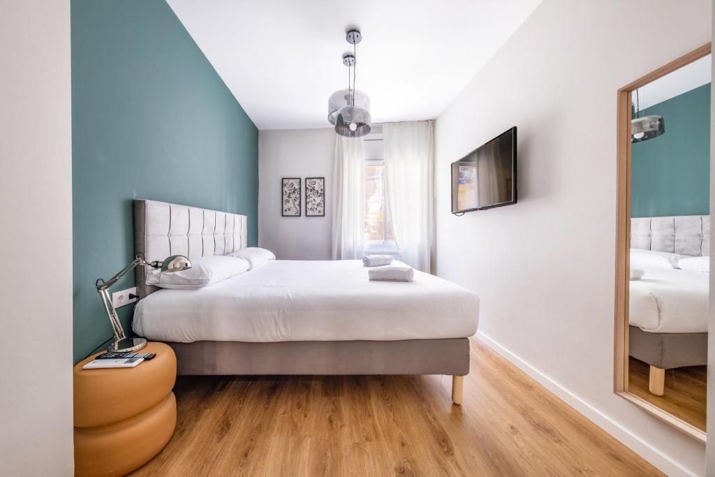 Postel nebo postele na pokoji v ubytování AinB Barcelona Sants Apartments