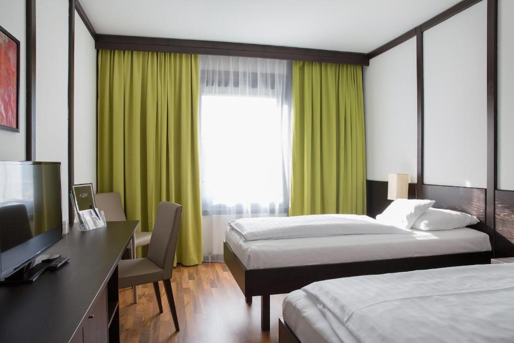 Postel nebo postele na pokoji v ubytování Hotel Central