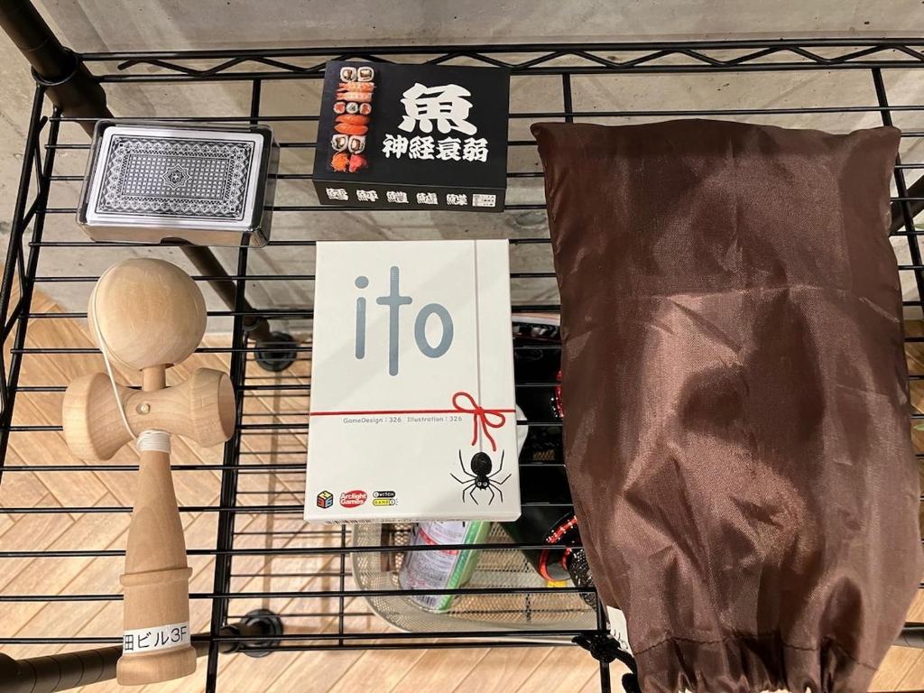 a shopping cart with a sign that says ittoc at 原田屋Hotel 3F in Tokyo