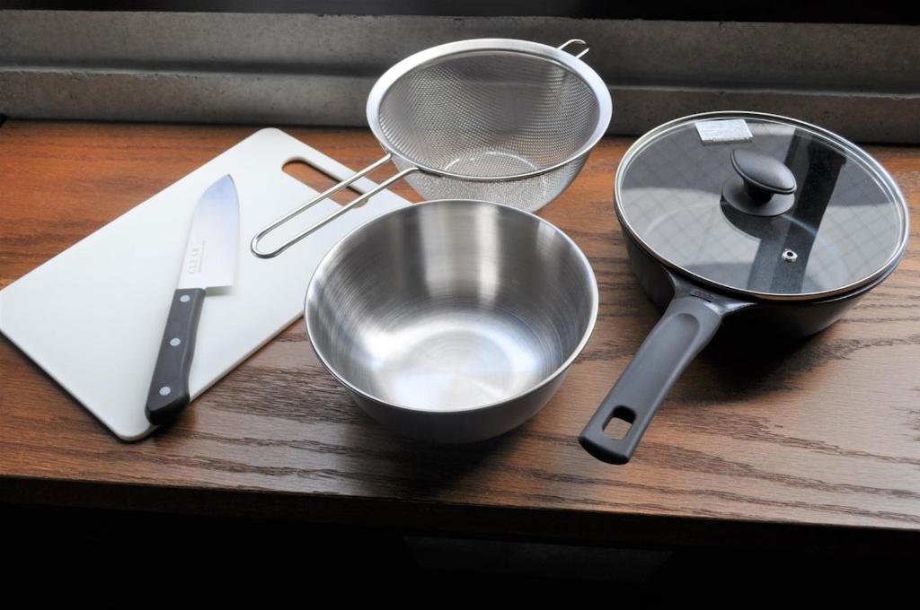 a counter with two measuring utensils and a bowl at 原田屋Hotel 3F in Tokyo
